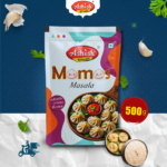 Ashish Momos Masala pack with key product features and serving suggestions.